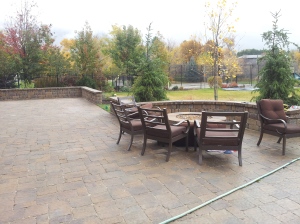 Natural gas fire pit in the landscaping done in pavers