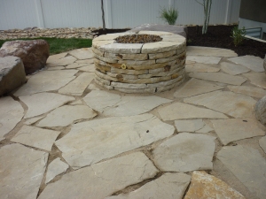 Flagstone patio, rock sitting and fire