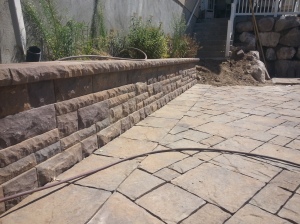 Landscaping in Bountiful Utah, landscaper installing, Huge rock boulder retaining walls, rock walls, Retaining, double pump energy efficient water features, walls, landscaping, Belgard natural gas fire pit, Belgard Mega Laffit Paver patio around the pool, Belgard Paver walls in Belair with belair caps, Paver fire pits, trees, topsoil, sod from bio grass sod farms, Landscape construction, landscaping in Bountiful, Utah, Bountiful City Landscaping In Utah, landscaping in bountiful city installing water features, water falls, fire pits, paver fire pits and patios, rock walls, steps, landscaping, landscapers, landscape contractors, landscape design, landscape installation, plants, custom landscaping