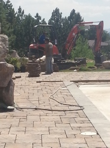 Landscaping in Bountiful Utah, landscaper installing, Huge rock boulder retaining walls, rock walls, Retaining, double pump energy efficient water features, walls, landscaping, Belgard natural gas fire pit, Belgard Mega Laffit Paver patio around the pool, Belgard Paver walls in Belair with belair caps, Paver fire pits, trees, topsoil, sod from bio grass sod farms, Landscape construction, landscaping in Bountiful, Utah, Bountiful City Landscaping In Utah, landscaping in bountiful city installing water features, water falls, fire pits, paver fire pits and patios, rock walls, steps, landscaping, landscapers, landscape contractors, landscape design, landscape installation, plants, custom landscaping